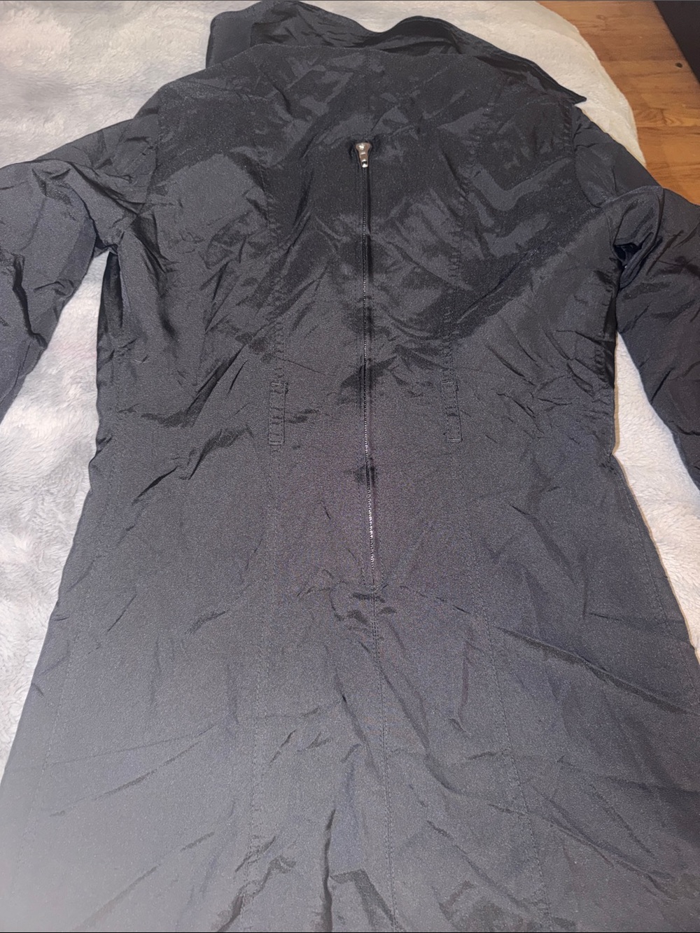 Preloved Fendi black nylon jacket turns into a bag pack excellent condition.